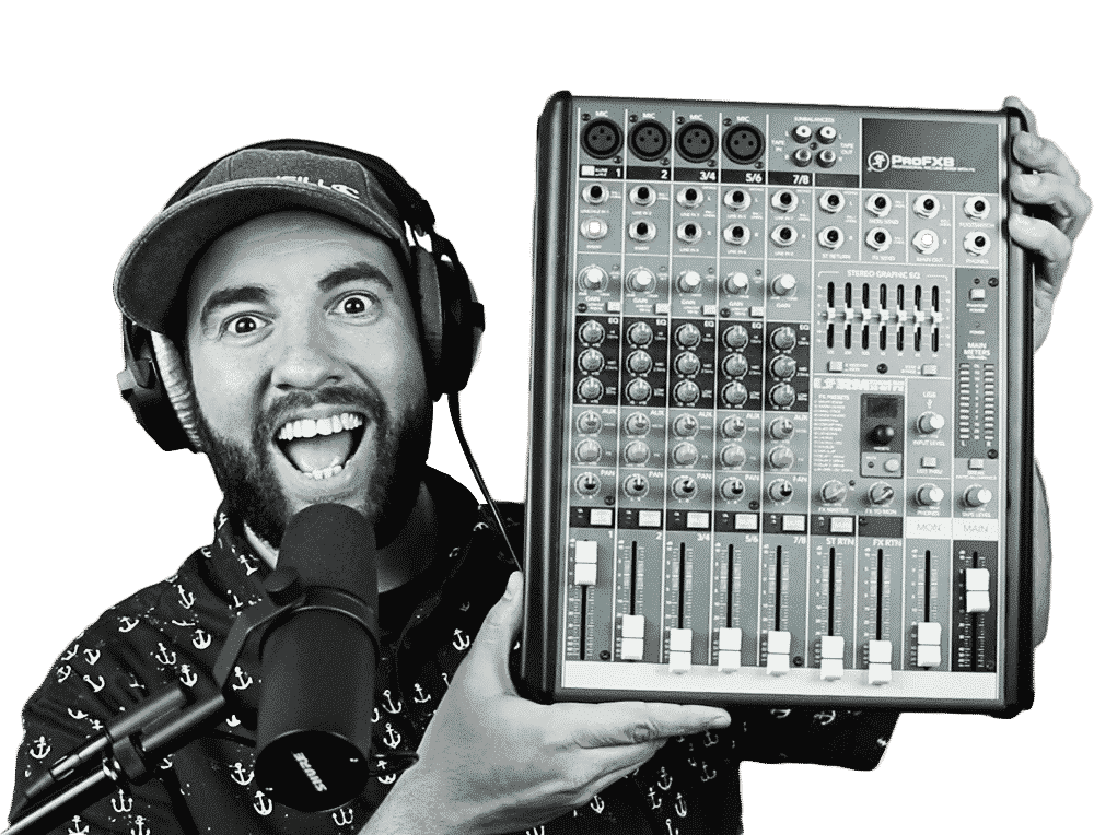 Matt Giovanisci Holding a Mixing Board with Headphones and a Microphone